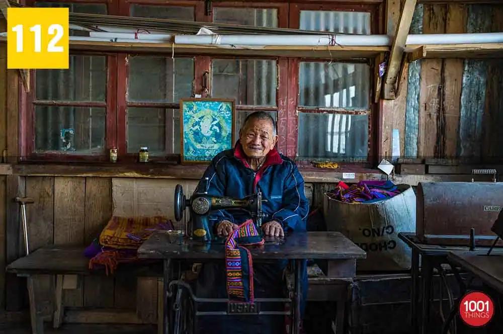 The old man sewing traditional item, Tibetan Refugee Self Help Centre