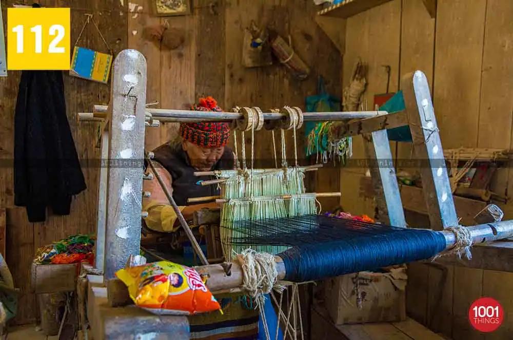 Using traditional weaving machine, Tibetan Refugee Self Help Centre